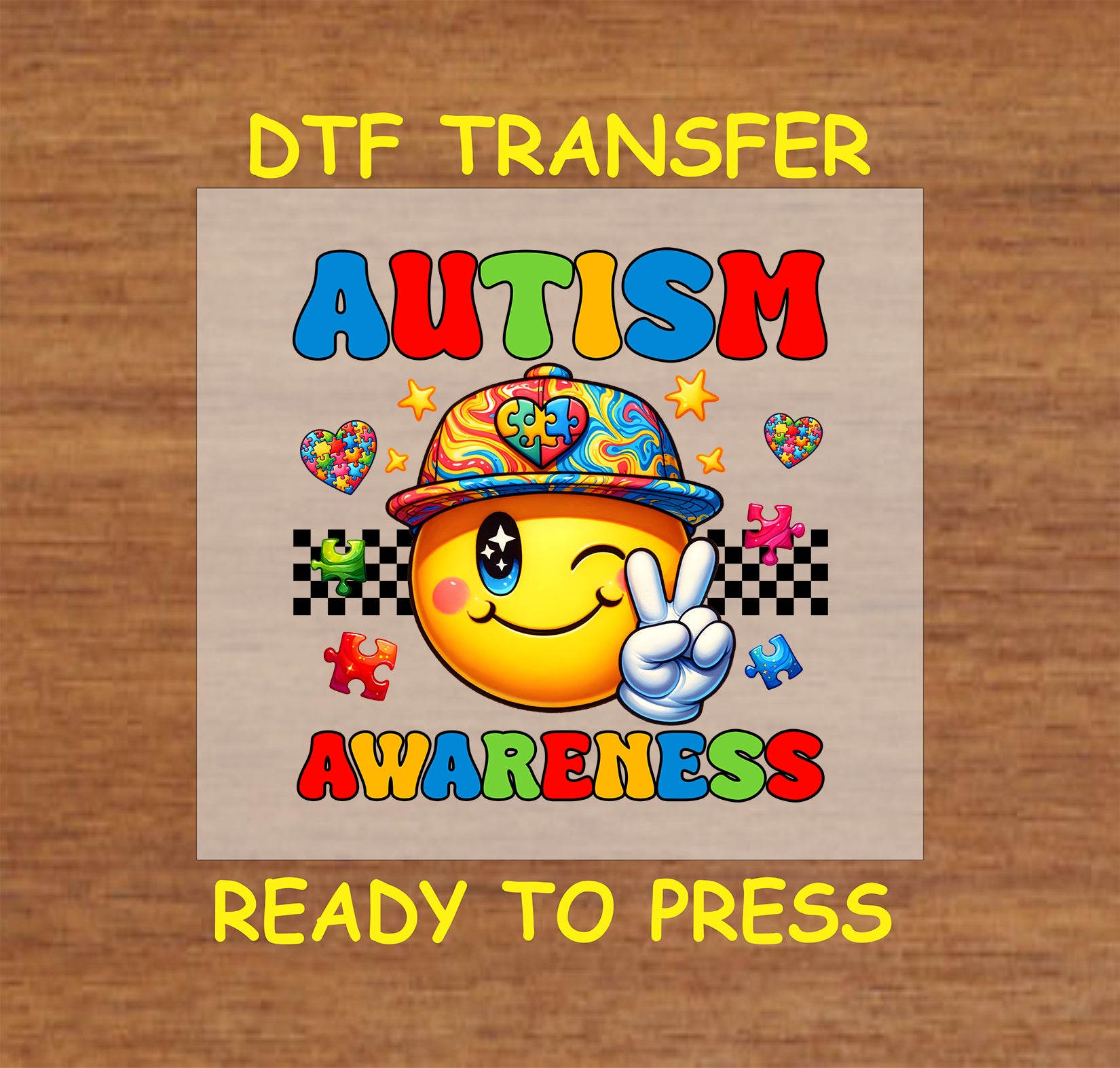 Bright autism awareness DTF transfer with a smiley face wearing a puzzle-piece hat.