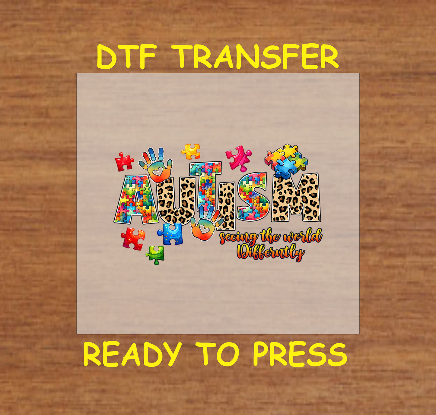 "Autism: Seeing the World Differently" DTF transfer with puzzle pieces, handprints, and leopard print, ready to press for apparel.
