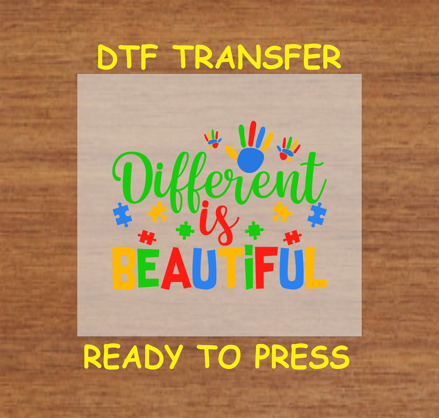 Vibrant "Different is Beautiful" DTF transfer with handprints, puzzle pieces, and bold colors, ready-to-press for custom apparel.