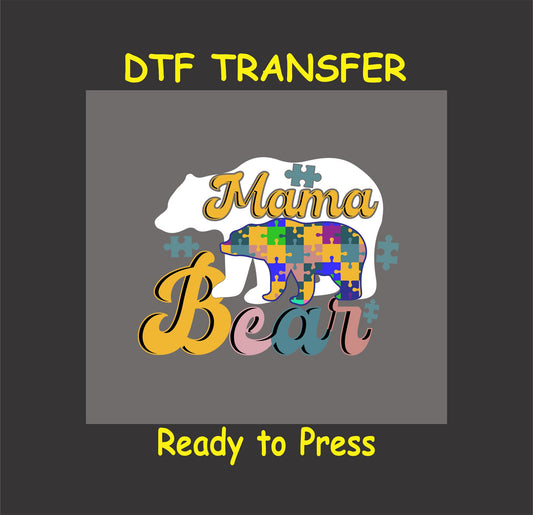 "Mama Bear" Autism Awareness DTF transfer featuring a puzzle-patterned bear and cub design with bold lettering.