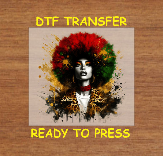 "DTF transfer of a woman with a red, green, and gold afro, wearing leopard print, bold makeup, and splattered paint accents."