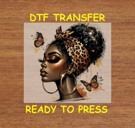 "DTF Transfer featuring an Afro queen with a leopard-print headscarf and butterflies, ready to press for custom apparel."