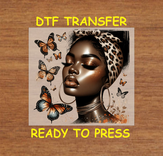 "DTF Transfer featuring an Afrocentric beauty with a leopard-print scarf and vibrant butterflies, ready to press."