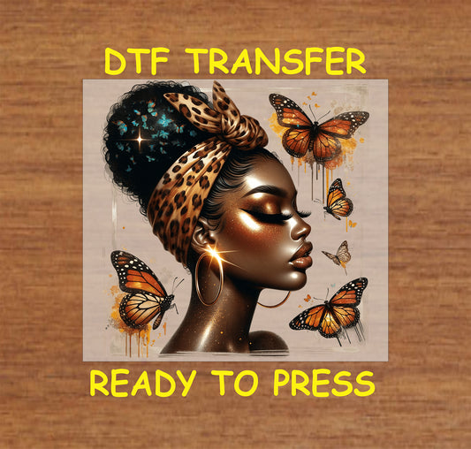 "DTF Transfer featuring an Afrocentric woman with a leopard scarf and butterflies, ready to press for custom apparel."