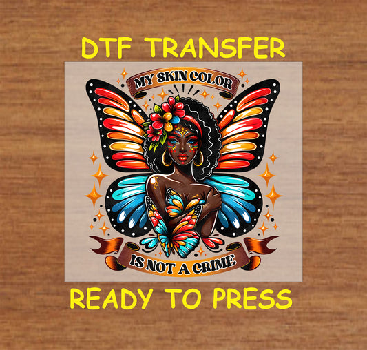 "DTF Transfer featuring a woman with colorful butterfly wings and the words 'My Skin Color Is Not A Crime,' ready to press for custom apparel."