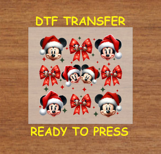 DTF transfer featuring festive characters in Santa hats with red bows and holiday accents.