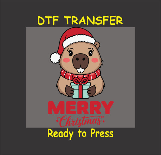 "Christmas capybara DTF transfer with Santa hat and gift, Merry Christmas text."