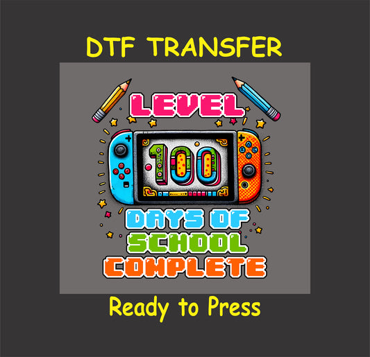 "Level 100 Days of School Complete" DTF transfer featuring a colorful gaming console design with vibrant lettering.