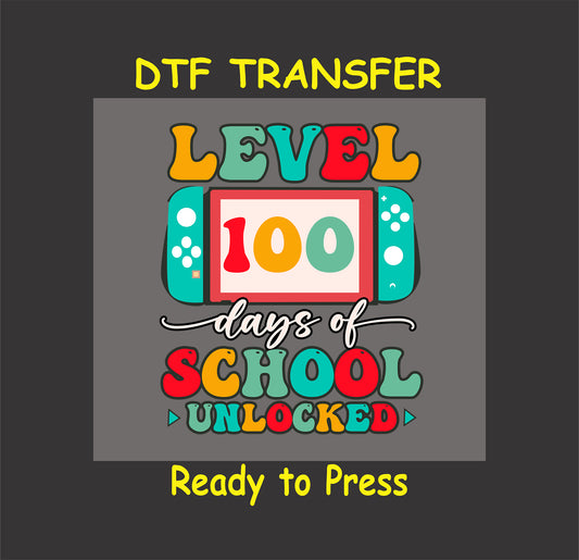 "Gaming-inspired Level 100 Days Unlocked DTF Transfer featuring a handheld console design in vibrant colors."