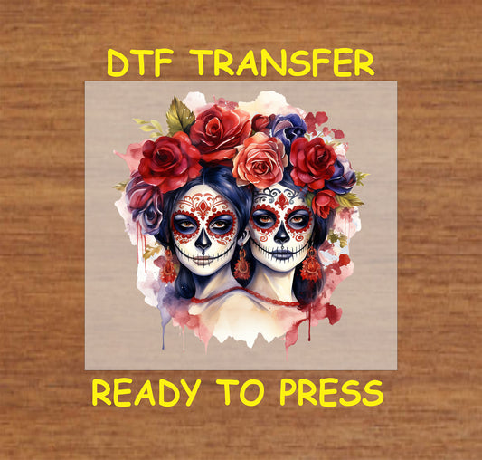 "Day of the Dead DTF Transfer featuring two La Catrina sugar skull faces adorned with roses and intricate designs."