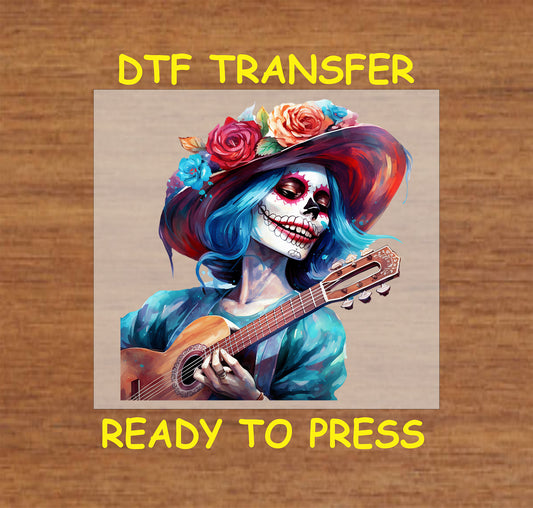Day of the Dead DTF transfer featuring a colorful Catrina with blue hair, floral hat, and guitar.
