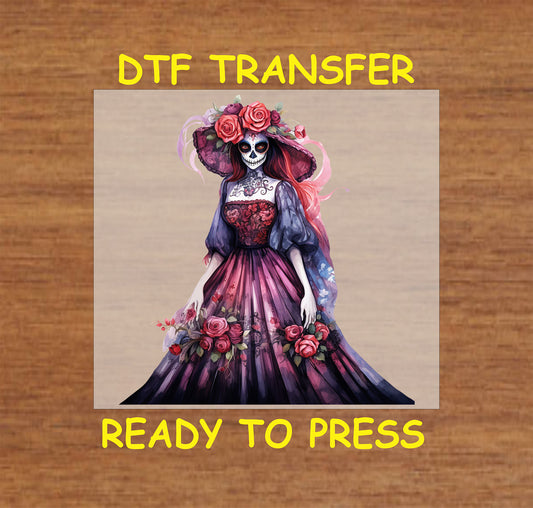 Floral Grace Catrina DTF transfer with a flowing purple-pink dress, rose-adorned hat, and intricate details.