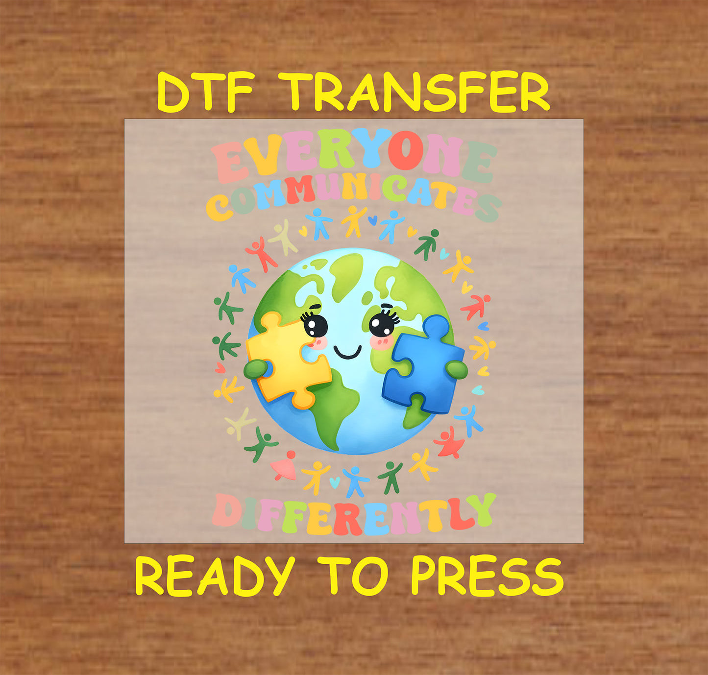 "Everyone Communicates Differently" Autism Awareness DTF transfer featuring a globe with puzzle pieces and colorful figures.