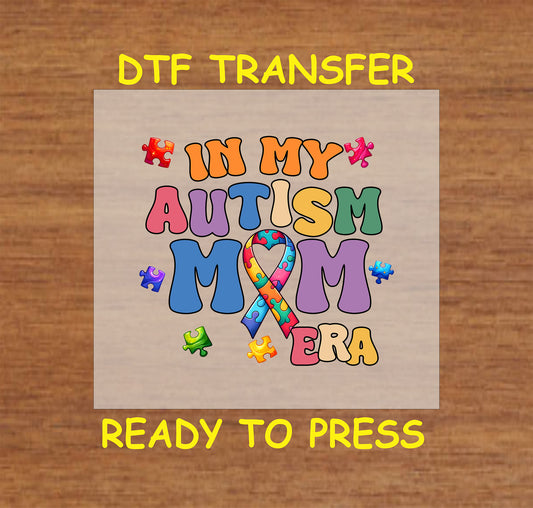 "In My Autism Mom Era" DTF transfer with colorful puzzle pieces, autism ribbon, and bold text.