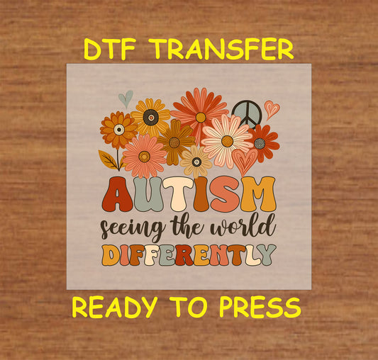 "Autism - Seeing the World Differently" DTF transfer with retro floral design, daisies, and warm colors.