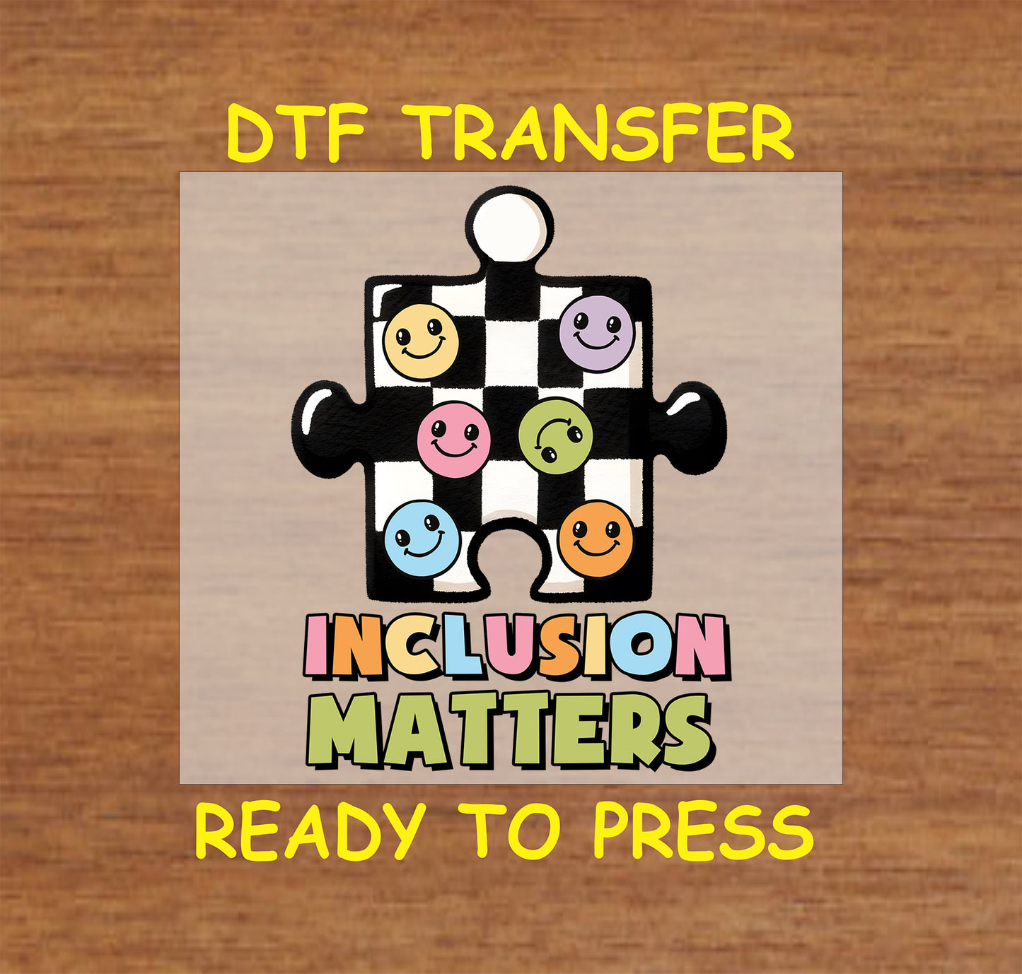 "Inclusion Matters" DTF transfer featuring a checkerboard puzzle piece design with colorful smiley faces and bold lettering.