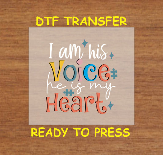 "DTF transfer featuring the phrase 'I am his Voice, he is my Heart' in colorful letters, with puzzle piece accents for autism awareness."