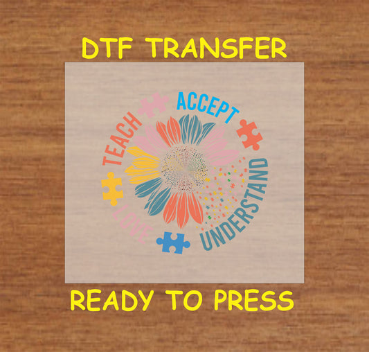 "DTF transfer featuring a colorful flower with puzzle pieces and the words 'Teach, Accept, Love, Understand' for autism awareness."