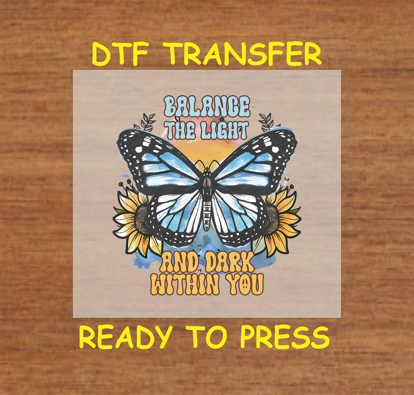 "DTF transfer featuring a butterfly with blue wings, sunflowers, and the phrase 'Balance the Light and Dark Within You.'"