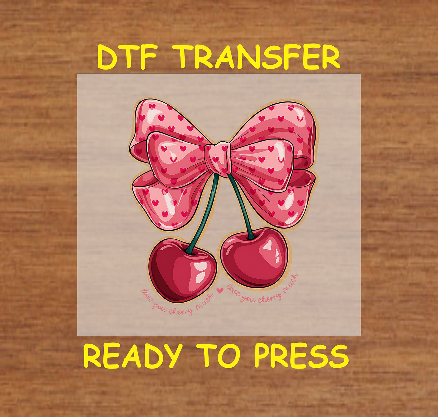 DTF transfer featuring two glossy cherries tied with a pink bow adorned with heart patterns, and the phrase "Love You Cherry Much" below.
