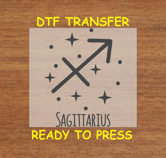 Sagittarius zodiac DTF transfer featuring the arrow symbol and celestial stars in black design.