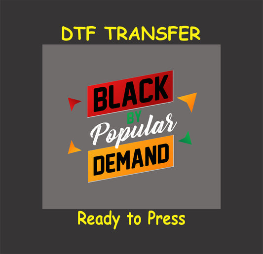 Black By Popular Demand DTF transfer with bold red, yellow, green, and white lettering, ready to press for custom apparel.