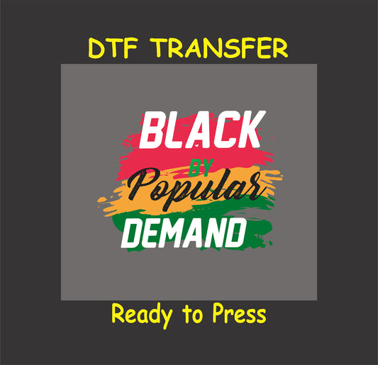 Black By Popular Demand DTF transfer with vibrant brush stroke design in red, yellow, green, and black, ready to press for apparel projects.