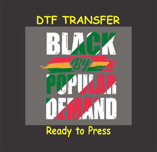 Black By Popular Demand DTF transfer with distressed brush stroke design in red, green, yellow, and white, ready to press for custom apparel.