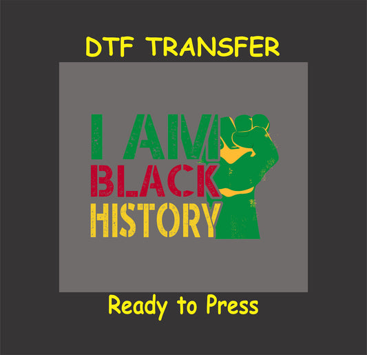 DTF transfer design with bold distressed text in red, yellow, and green reading "I Am Black History" alongside a raised fist, ready to press.