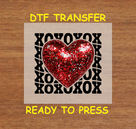"XOXO Glitter Heart DTF Transfer featuring a red glitter heart over a black XOXO pattern, perfect for Valentine's Day."