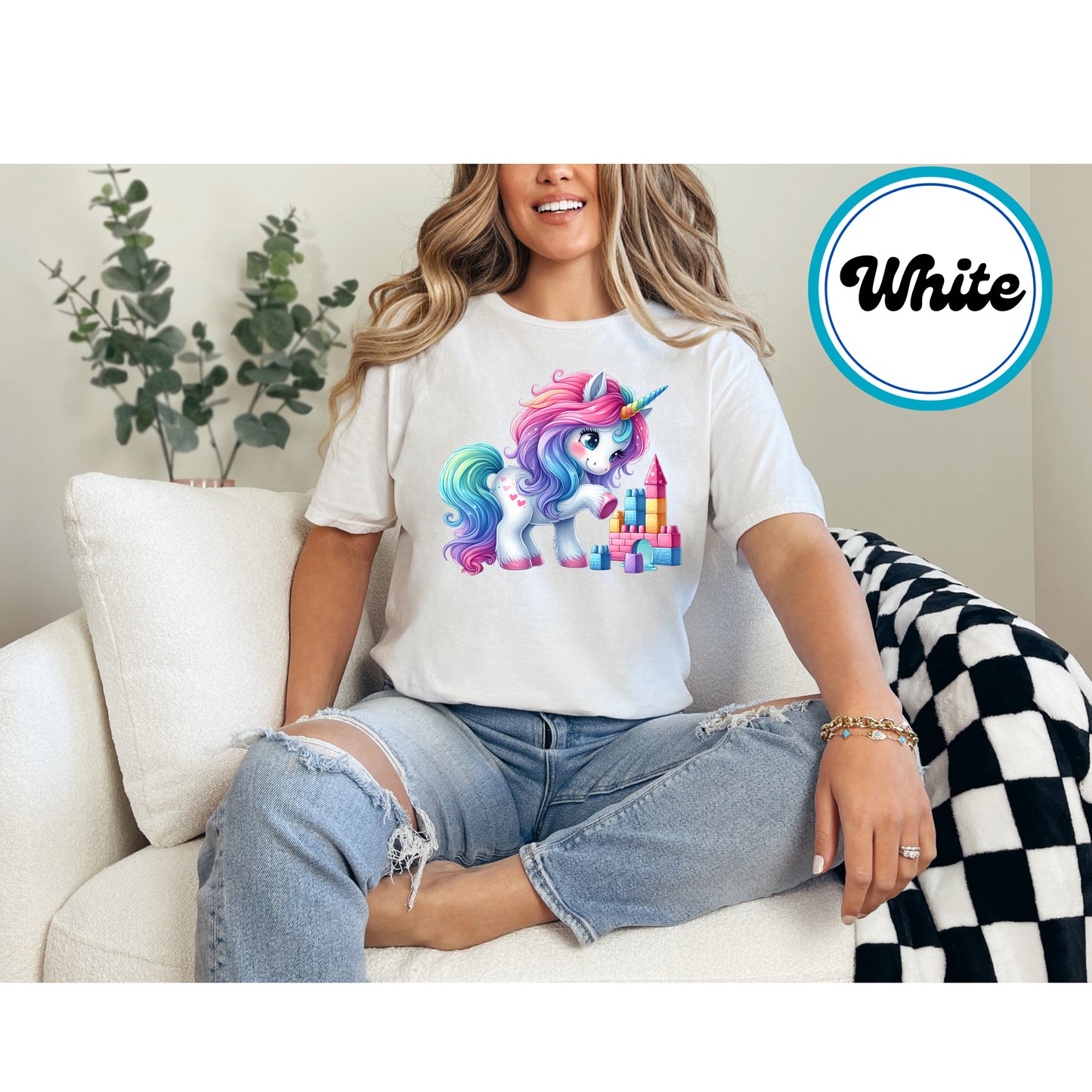Cute rainbow unicorn with heart accents and a colorful castle DTF transfer.