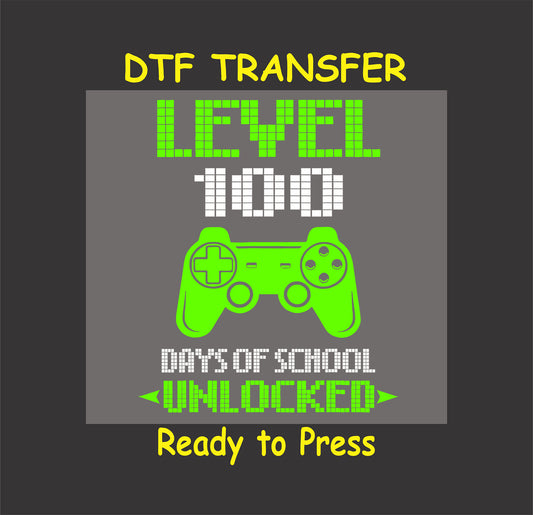 "Level 100 Days of School Unlocked" DTF transfer featuring a neon green gaming controller.