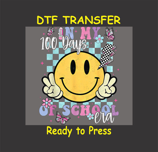 Smiley face "In My 100 Days of School Era" DTF transfer with checkered background, butterflies, and flowers.