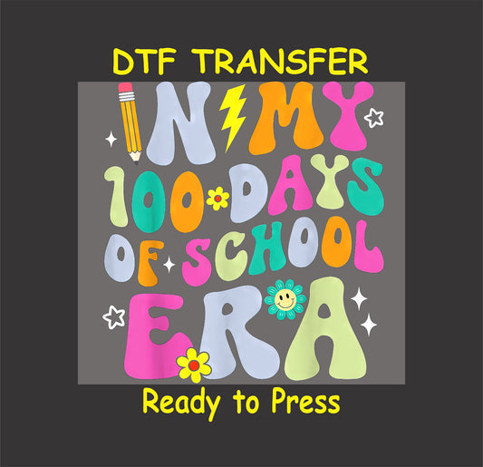 "In My 100 Days of School Era" DTF transfer with colorful letters, flowers, and fun school-themed elements.