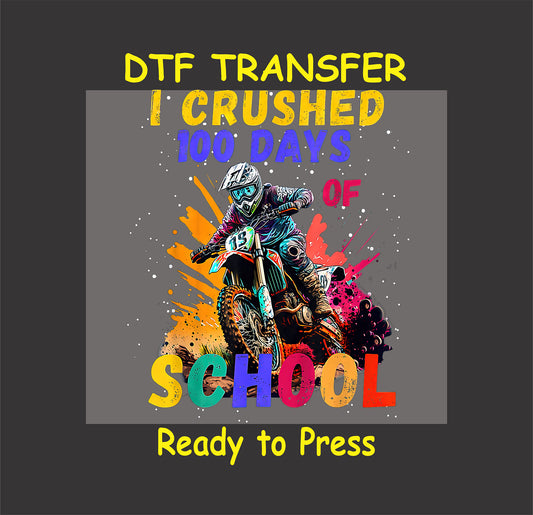 Motocross rider with splashes of colorful paint and text "I Crushed 100 Days of School" on a DTF transfer design.