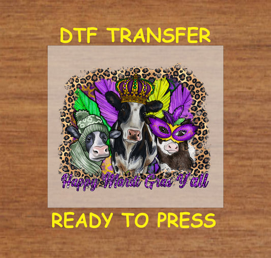 Three cows wearing Mardi Gras accessories, including a crown, mask, and feathers, with a leopard print background.