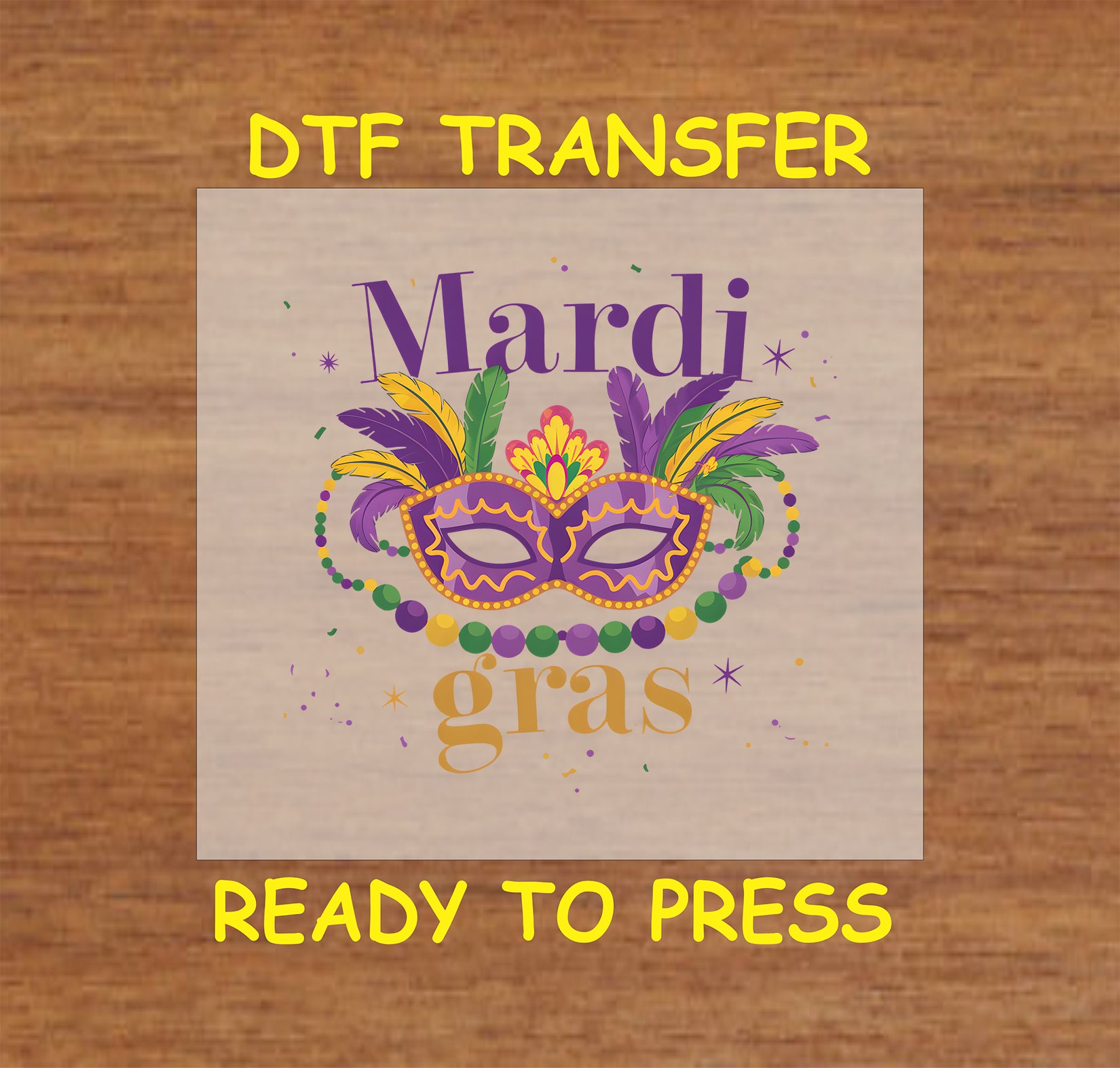 DTF transfer with a Mardi Gras mask, feathers, and festive beads in purple, green, and gold.