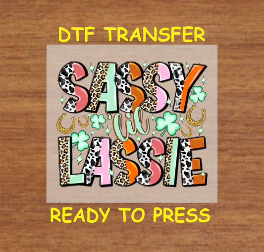 St. Patrick’s Day DTF transfer with bold lettering, shamrocks, and horseshoes.