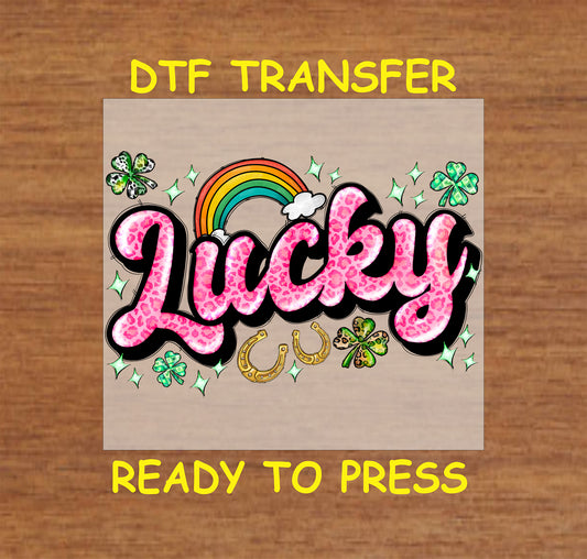 Pink leopard print "Lucky" text with shamrocks, rainbow, and golden horseshoes.