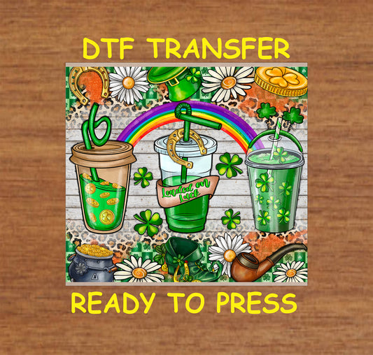 Three green drinks with shamrocks, gold coins, and "Loaded on Luck" text.