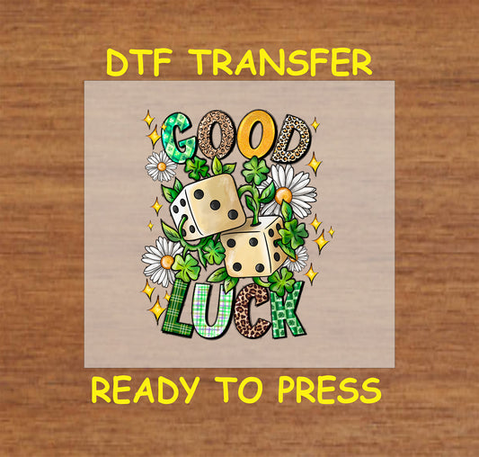 St. Patrick’s Day DTF transfer with "Good Luck" text, dice, shamrocks, and daisies.