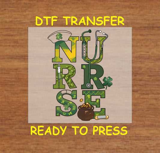 St. Patrick’s Day DTF transfer with nurse hat, stethoscope, syringe, and pot of gold in green and shamrock patterns.