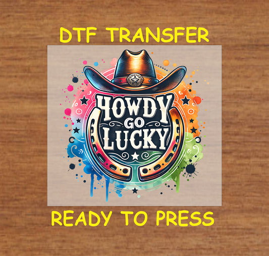 Cowboy hat and horseshoe with "Howdy Go Lucky" text in a colorful splash background.