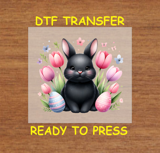 Black bunny with pink tulips and Easter eggs, soft pastel colors.