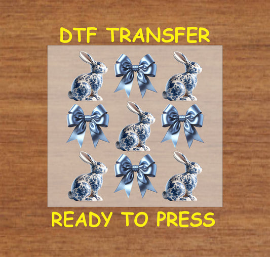 Chinoiserie blue bunnies with matching satin bows in a decorative Easter pattern.