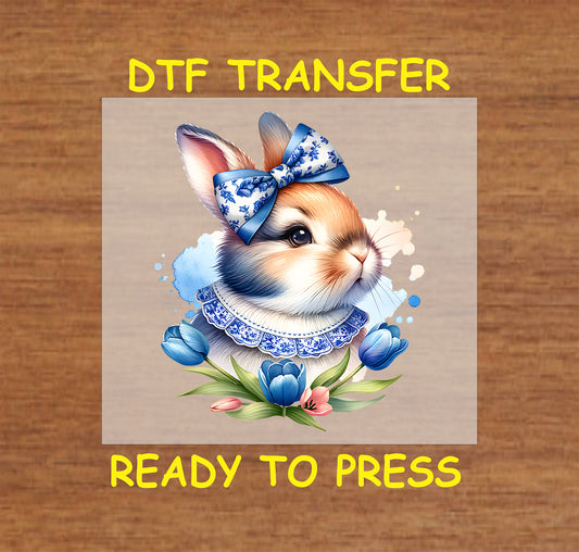 Elegant Easter bunny with a chinoiserie bow and lace collar, surrounded by tulips.