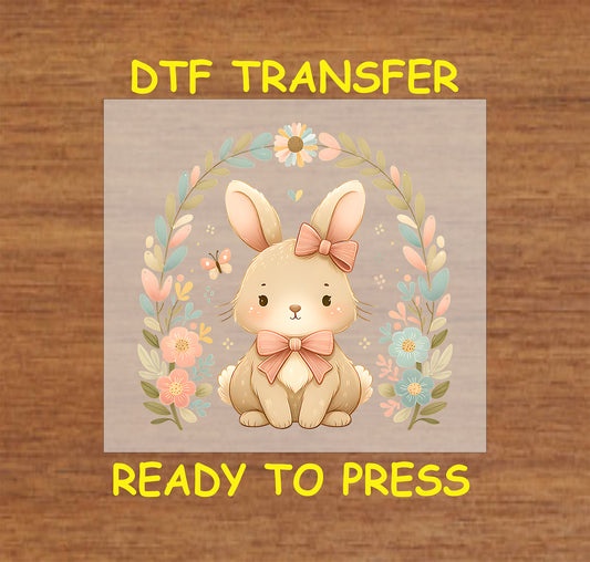 Adorable bunny with a bow, surrounded by pastel flowers and butterflies.