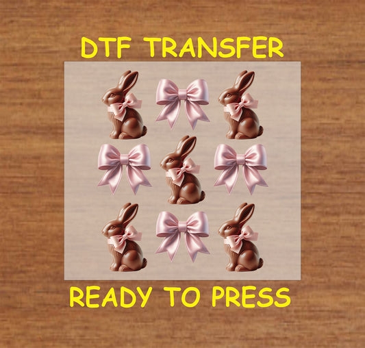 Chocolate bunny with pastel pink bows, perfect for Easter apparel.