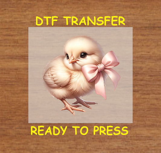 Soft pastel Easter chick with a pink satin bow.