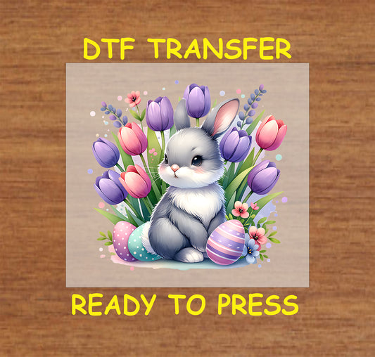 Fluffy bunny with colorful tulips and Easter eggs.